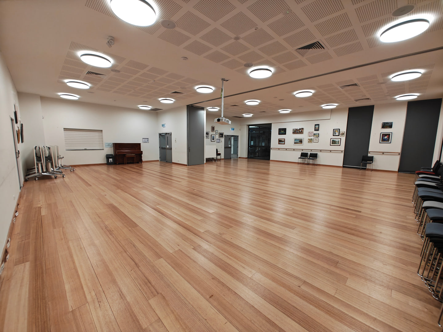 Clean timber floor across a large community hall