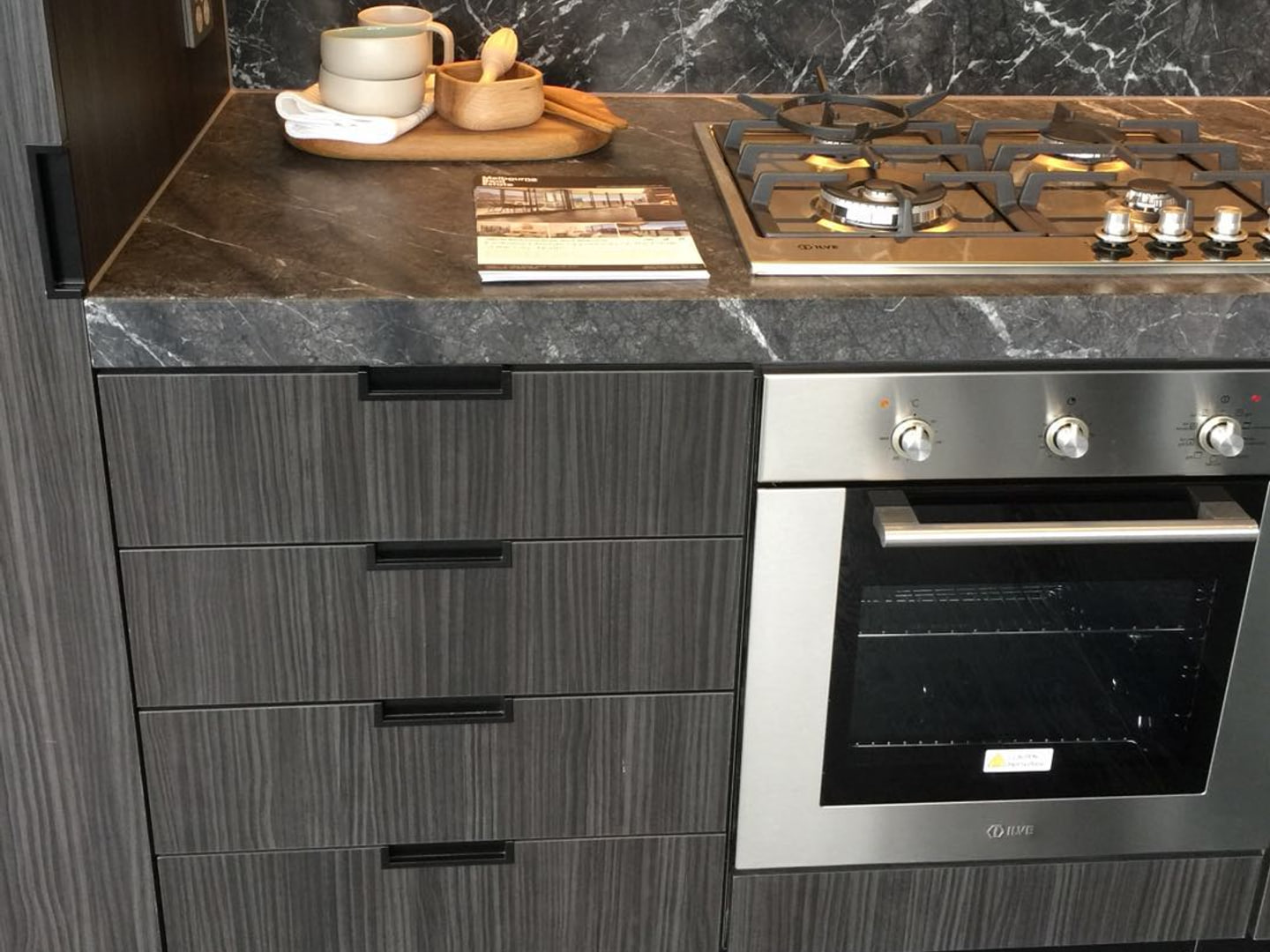 Clean cooktop, splashback and kitchen preparation area