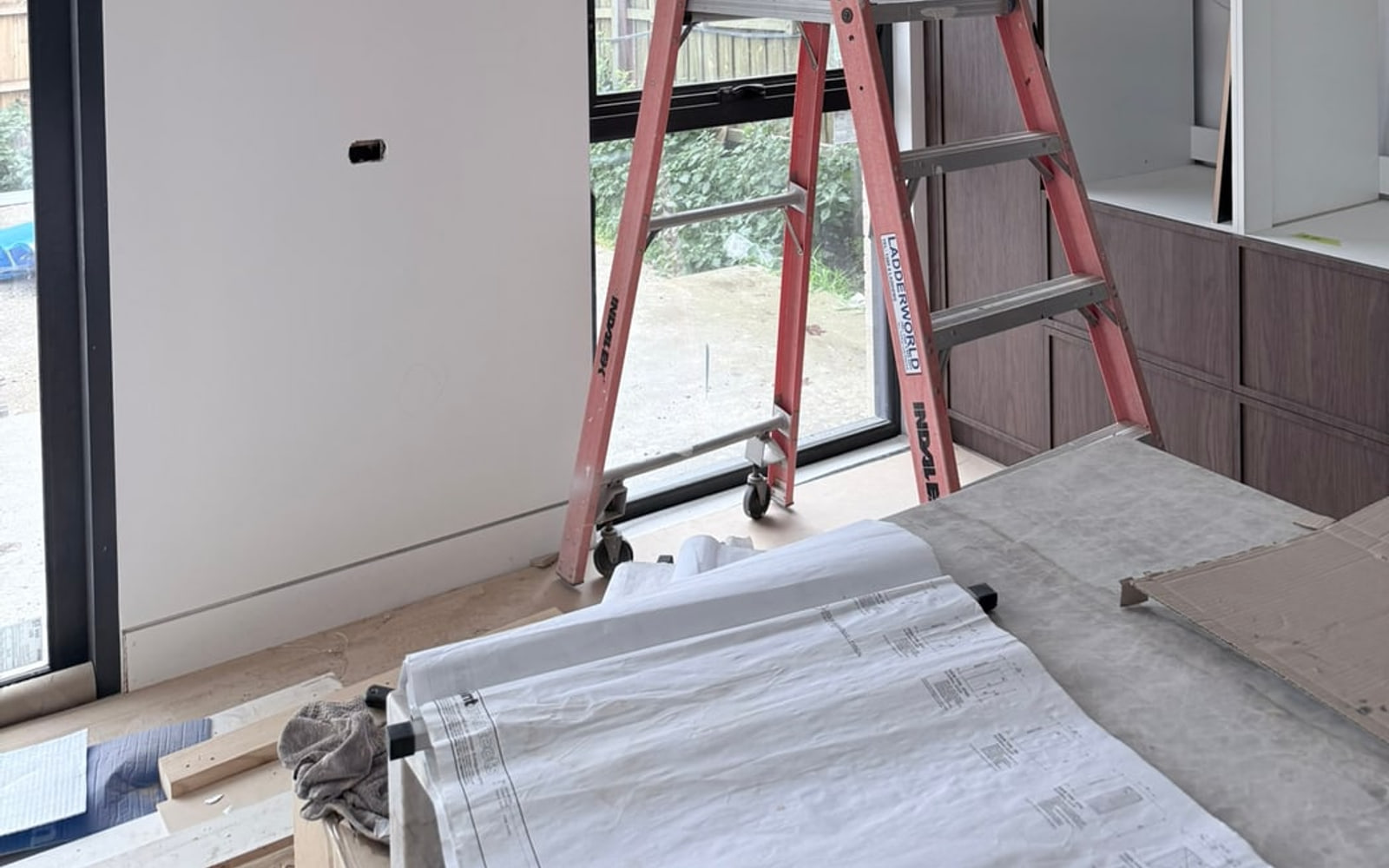 Near-complete Melbourne interior with protected surfaces ready for builders cleaning